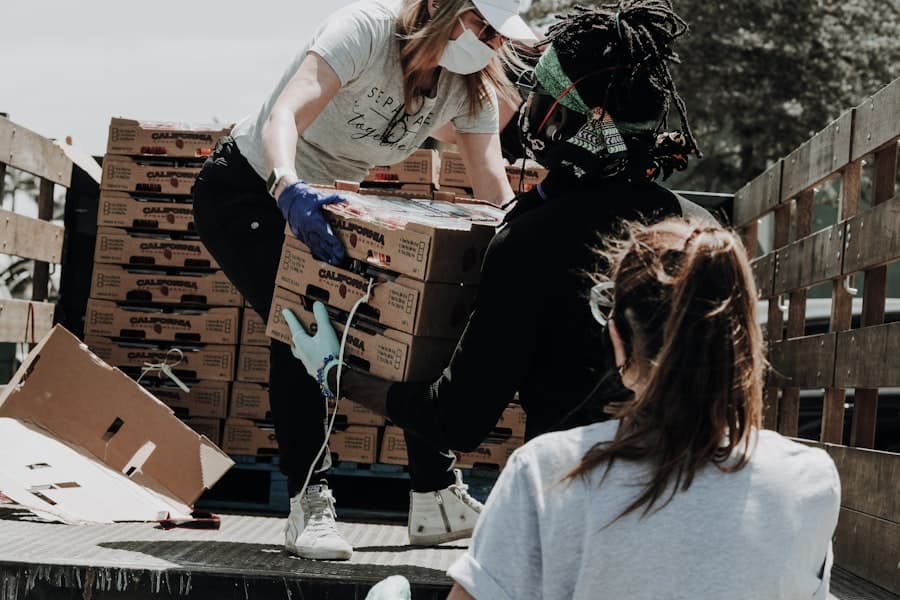 Volunteers moving crates together